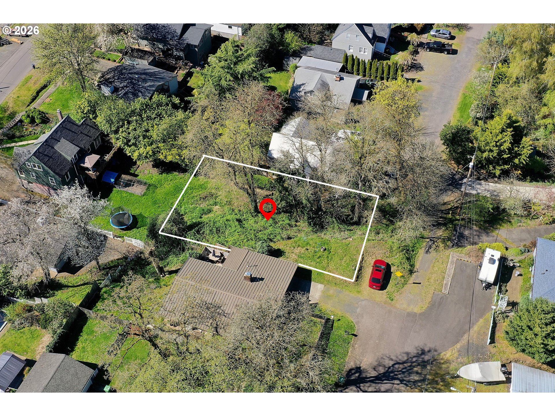 an aerial view of house yard and outdoor seating