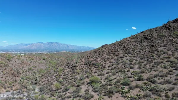 a view of a large building with a mountain in the background