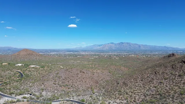 a view of a field with an ocean