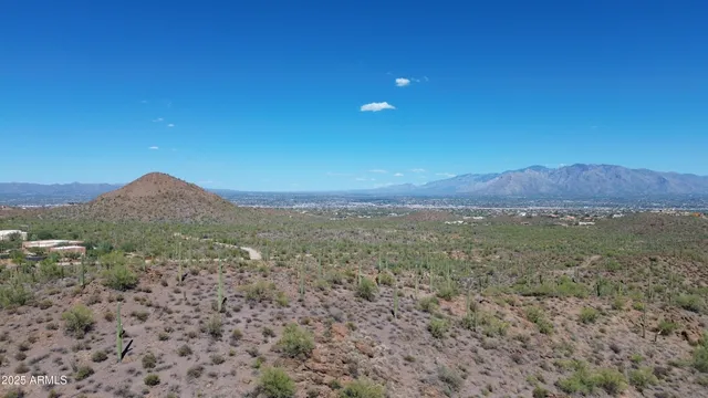 a view of a large mountain with a mountain in the background