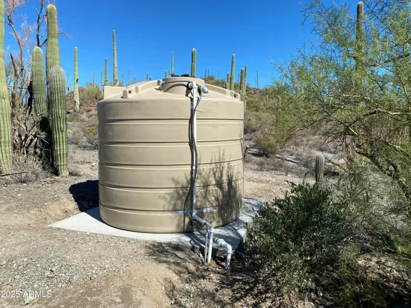 a view of a pathway with a field