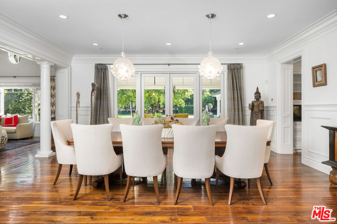 23924 Long Valley Road Hidden Hills, CA 91302 - Photo 11 of 46 a view of a dining room with furniture window and wooden floor