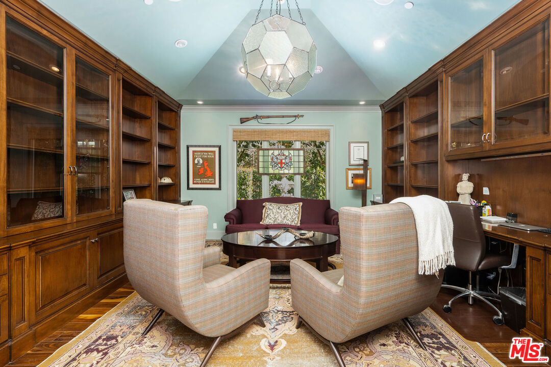 23924 Long Valley Road Hidden Hills, CA 91302 - Photo 19 of 46 a living room with furniture and a large window