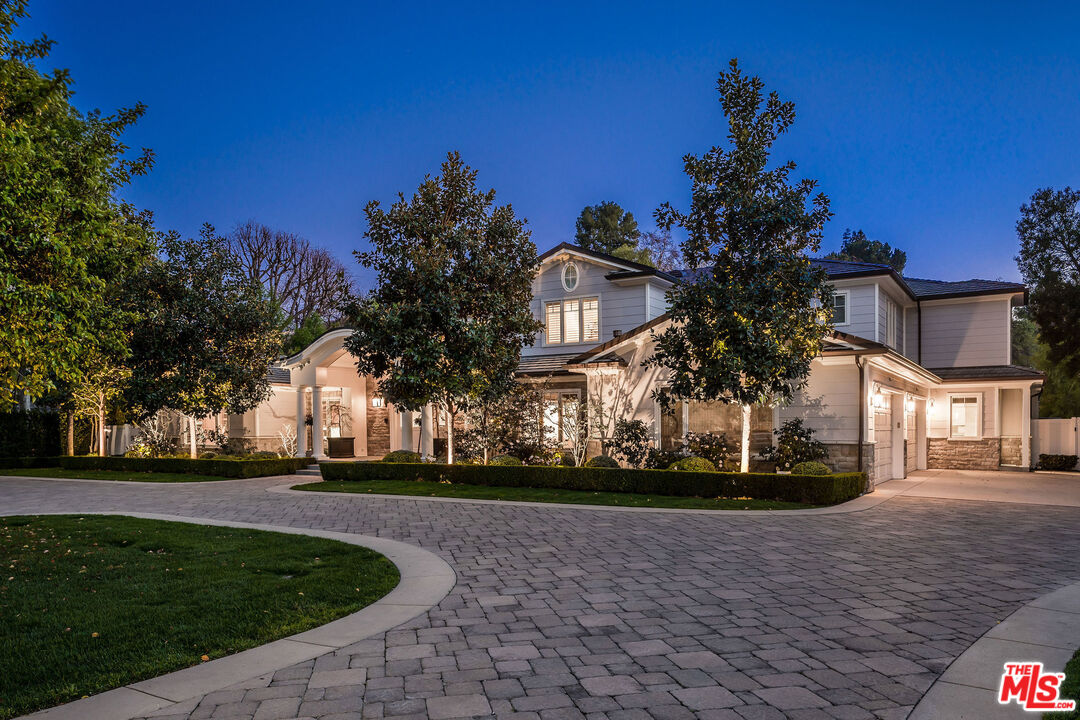 23924 Long Valley Road Hidden Hills, CA 91302 - Photo 3 of 46 a front view of a house with a yard