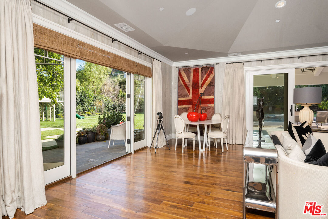 23924 Long Valley Road Hidden Hills, CA 91302 - Photo 26 of 46 a view of a dining room with furniture window and wooden floor