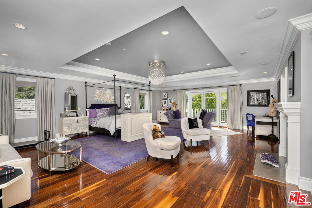23924 Long Valley Road Hidden Hills, CA 91302 - Photo 30 of 46 a living room with furniture and a wooden floor