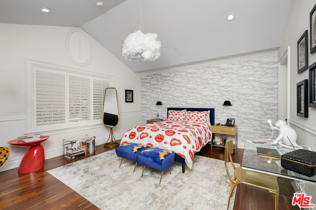 23924 Long Valley Road Hidden Hills, CA 91302 - Photo 38 of 46 a bedroom with a bed and wooden floor