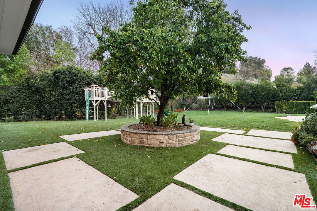 23924 Long Valley Road Hidden Hills, CA 91302 - Photo 40 of 46 a view of a garden with trees