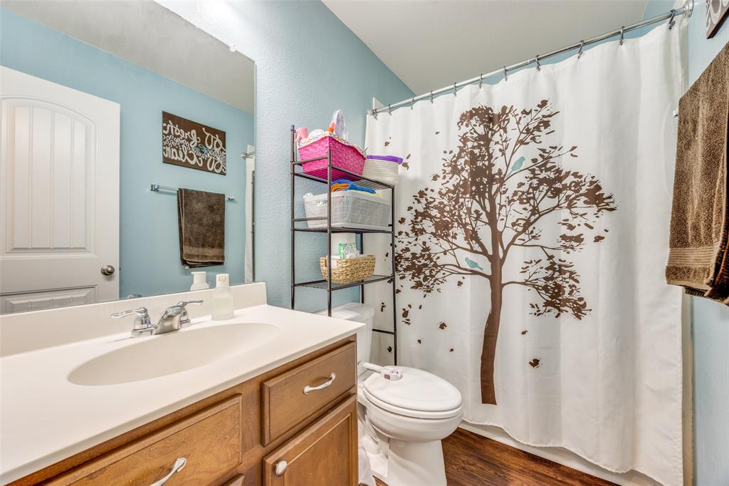 1011 Riverstone Trail Princeton, TX 75407 - Photo 17 of 26 a bathroom with a sink toilet and shower