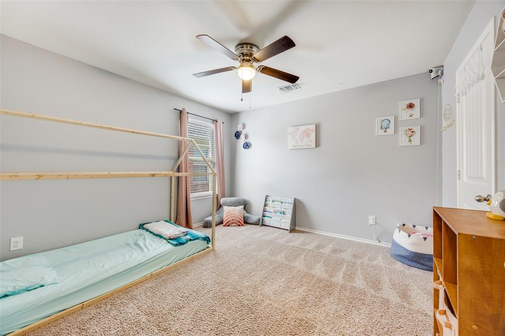 1011 Riverstone Trail Princeton, TX 75407 - Photo 18 of 26 a bedroom with bed and window