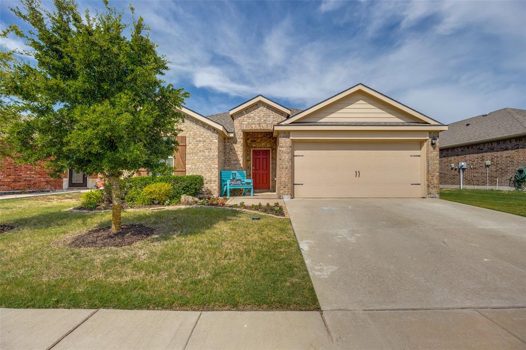 1011 Riverstone Trail Princeton, TX 75407 - Photo 2 of 26 a front view of a house with a yard