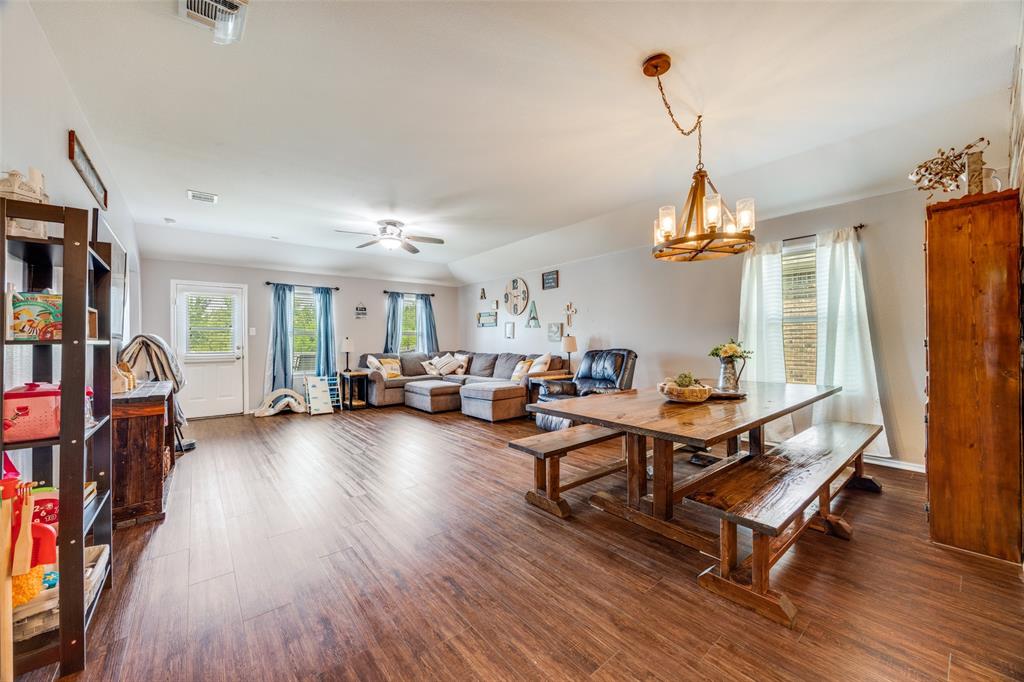 1011 Riverstone Trail Princeton, TX 75407 - Photo 4 of 26 a living room with furniture and a wooden floor