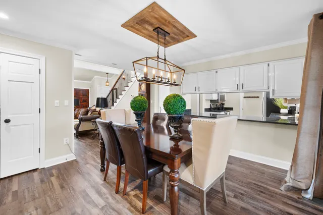 a view of kitchen with stainless steel appliances granite countertop cabinets and wooden floor