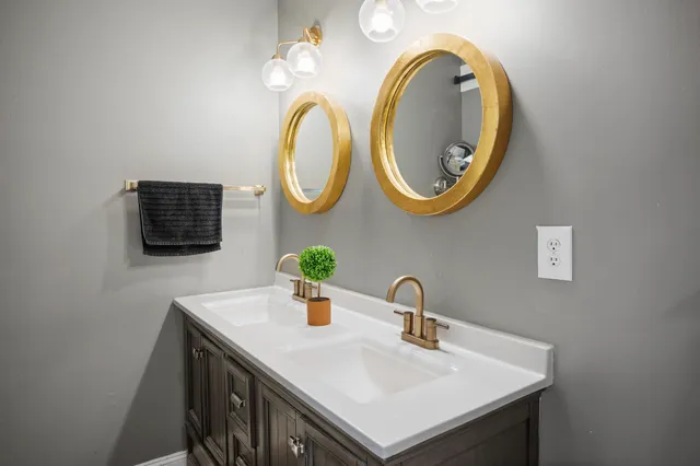 a bathroom with a sink and a mirror