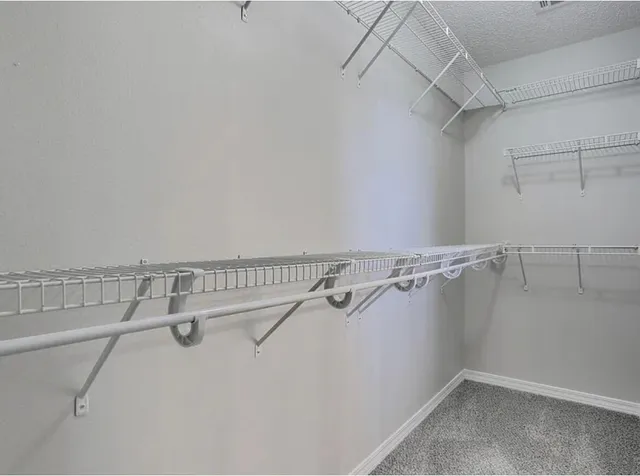 a view of a room with racks on the wall