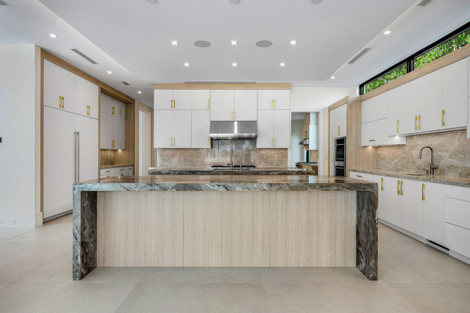 191 Coconut Palm Road Boca Raton, FL 33432 - Photo 15 of 81 a kitchen with stainless steel appliances granite countertop a stove a sink and a refrigerator