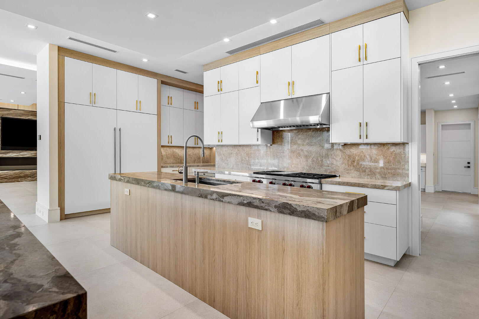 191 Coconut Palm Road Boca Raton, FL 33432 - Photo 16 of 81 a kitchen with stainless steel appliances granite countertop a stove a sink and a refrigerator