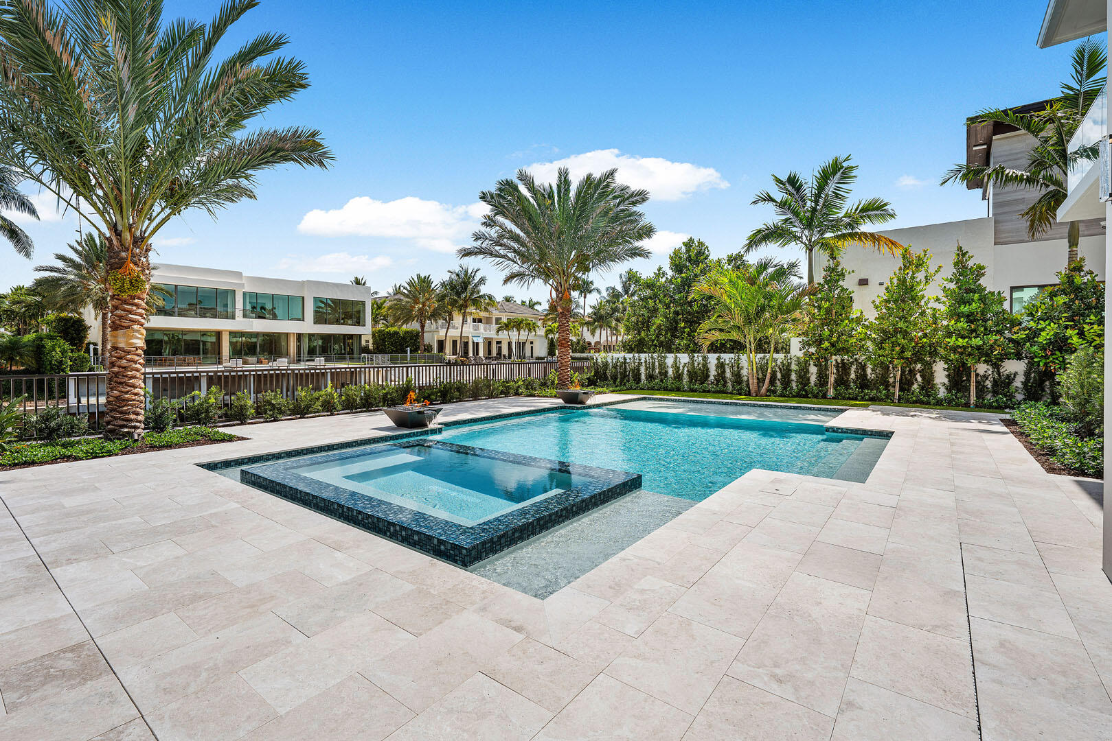 191 Coconut Palm Road Boca Raton, FL 33432 - Photo 24 of 81 a view of a swimming pool with a patio