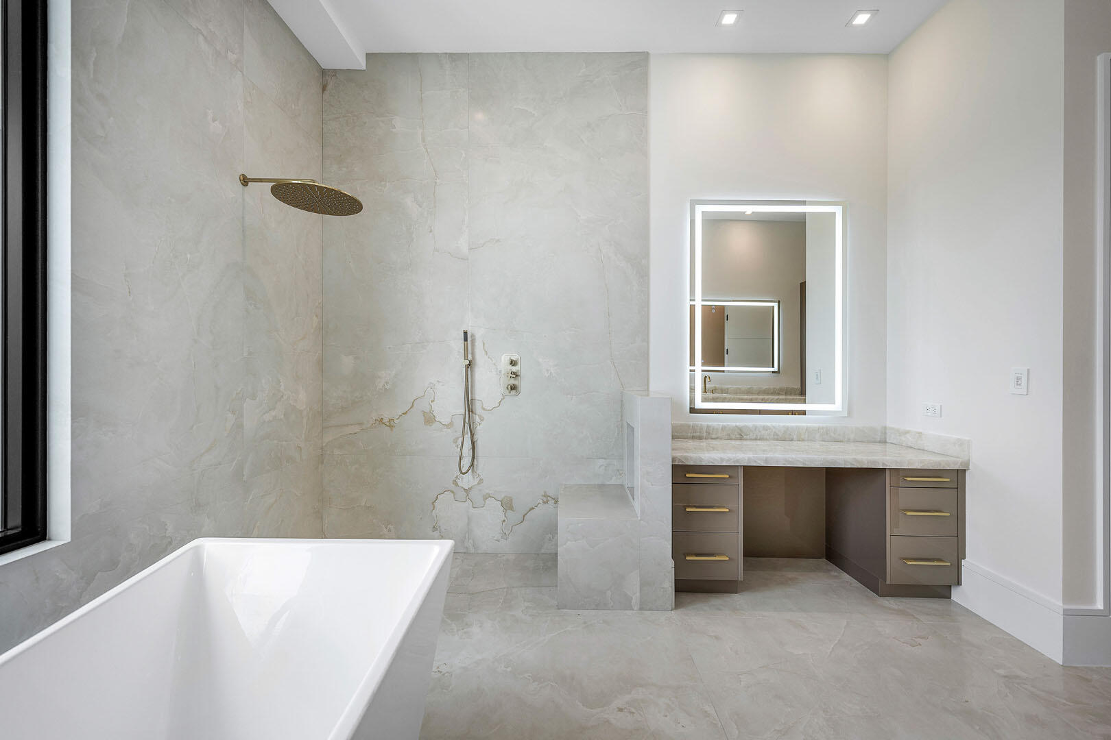 191 Coconut Palm Road Boca Raton, FL 33432 - Photo 46 of 81 a bathroom with a bathtub and a sink