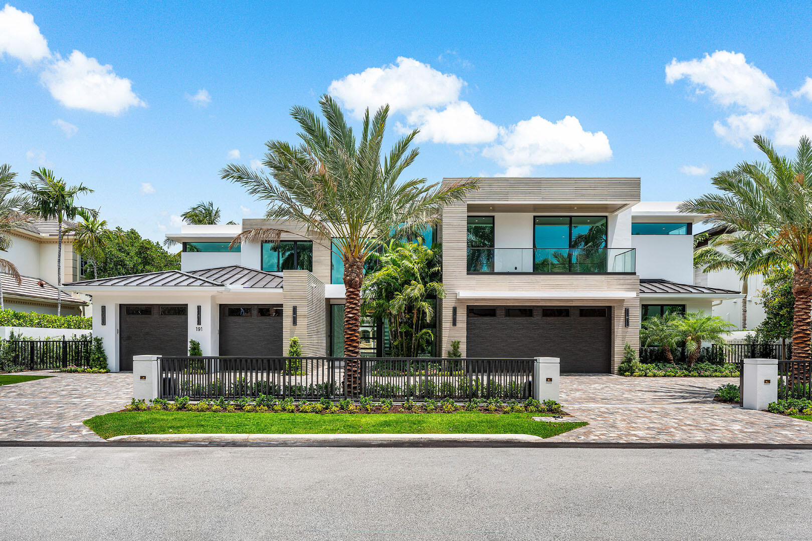 191 Coconut Palm Road Boca Raton, FL 33432 - Photo 5 of 81 a front view of house with a garden and plants