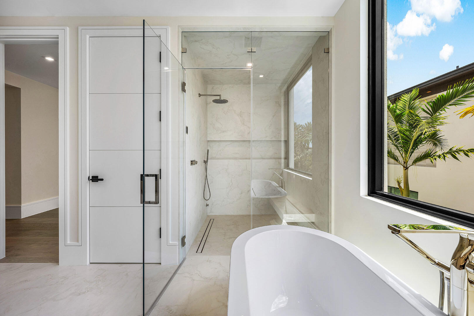 191 Coconut Palm Road Boca Raton, FL 33432 - Photo 53 of 81 a bathroom with a bathtub and a shower