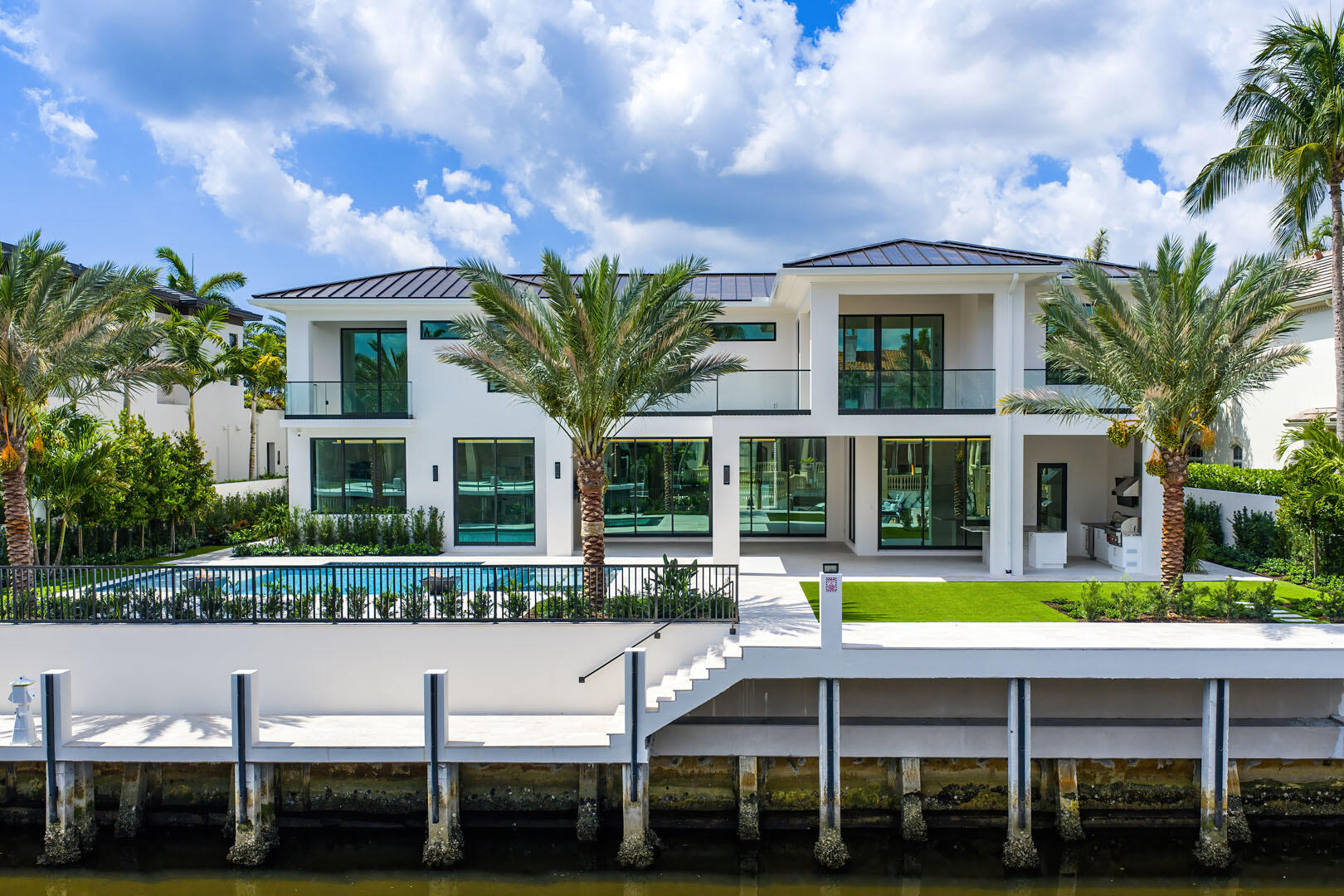 191 Coconut Palm Road Boca Raton, FL 33432 - Photo 70 of 81 a view of a house with a swimming pool