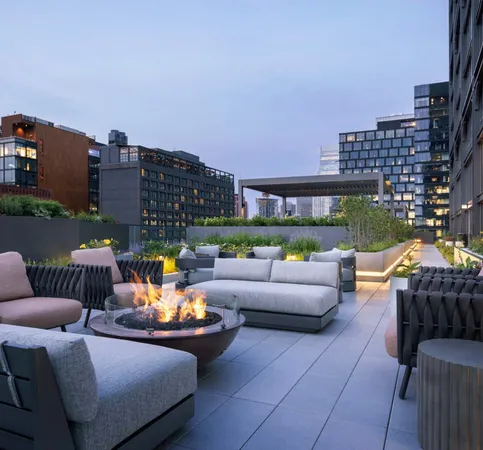 a outdoor living space with furniture and city view