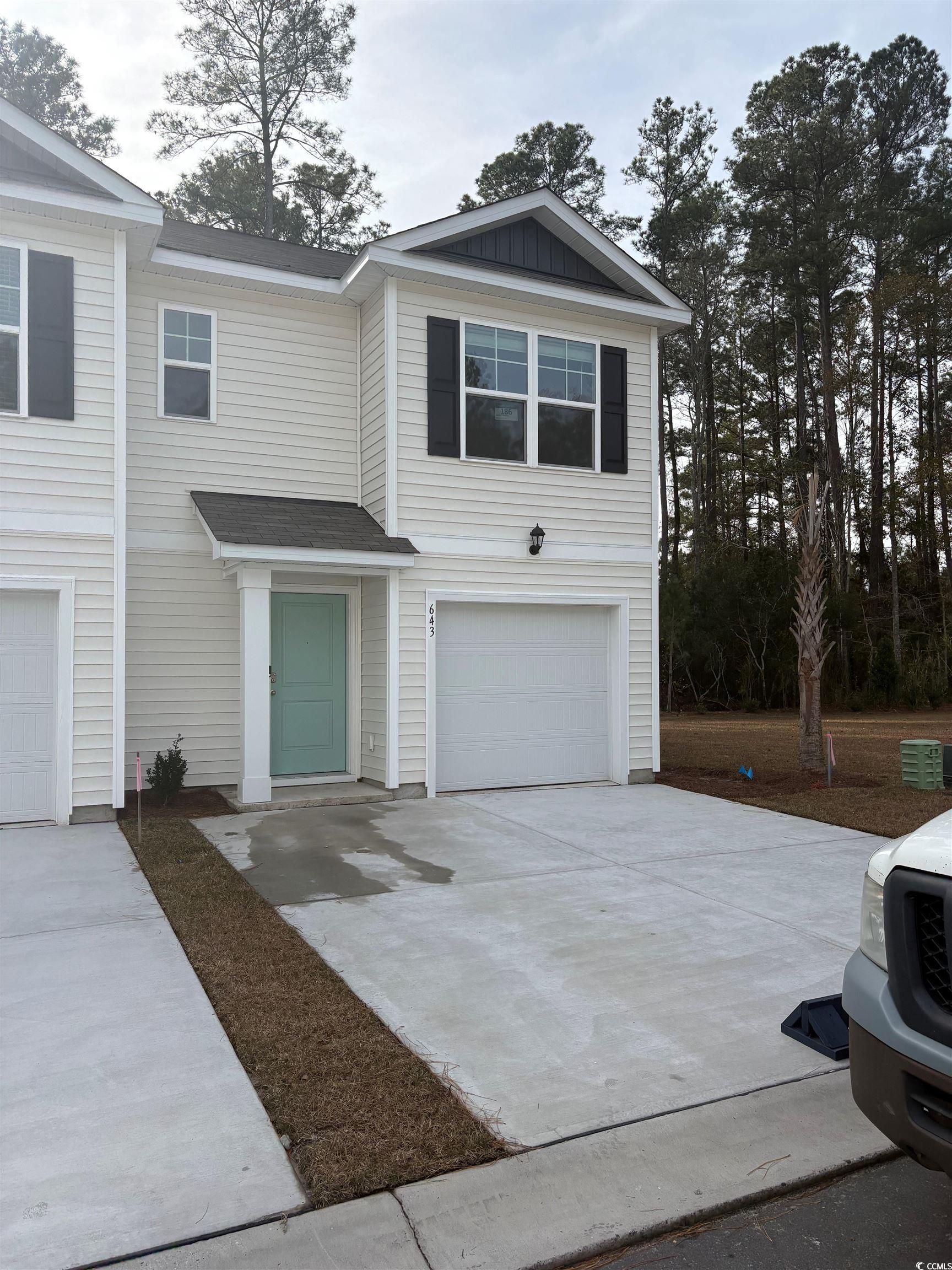 643 Golden Resin Road, Unit LOT 186 Conway, SC 29526 - Photo 1 of 40 View of front facade with concrete driveway, a garage, and roof with shingles