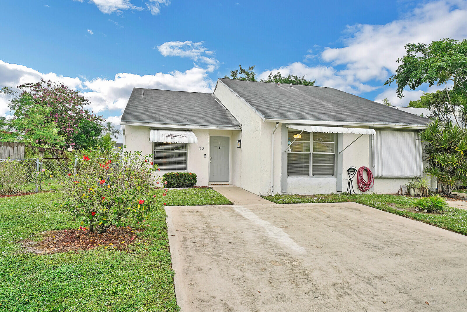 113 Pinewood Court Jupiter, FL 33458 - Photo 1 of 26 Front of the Home
