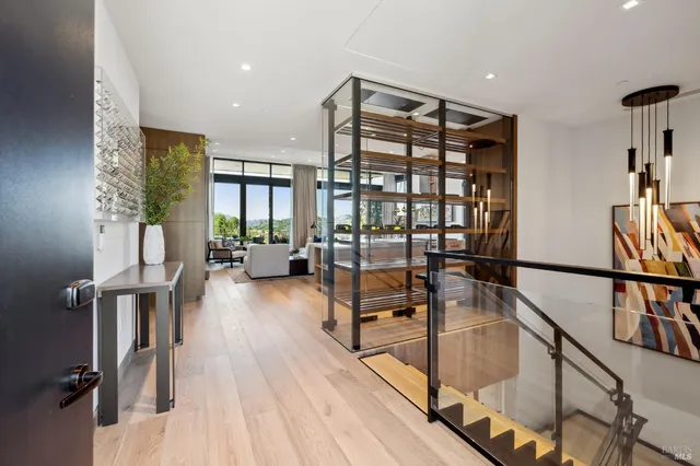 a living room with furniture wooden floor and a fireplace