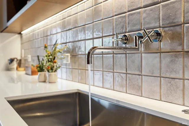 a view of a balcony with table and chairs
