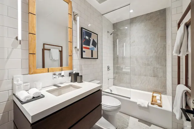 a bathroom with a sink a mirror and a window