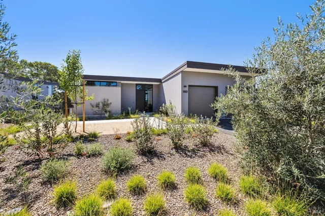 a view of a chairs and table in the patio