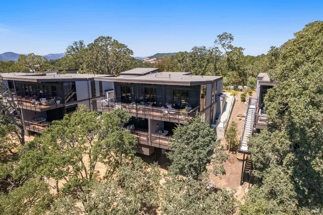a view of a house with a yard and sitting area