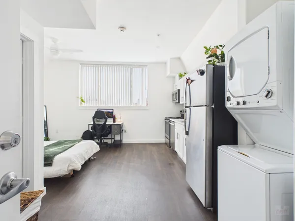 a bed room with furniture and a chandelier