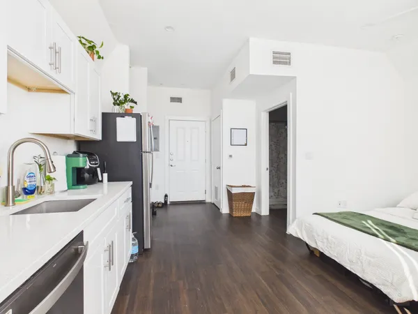 a kitchen with a sink and a refrigerator