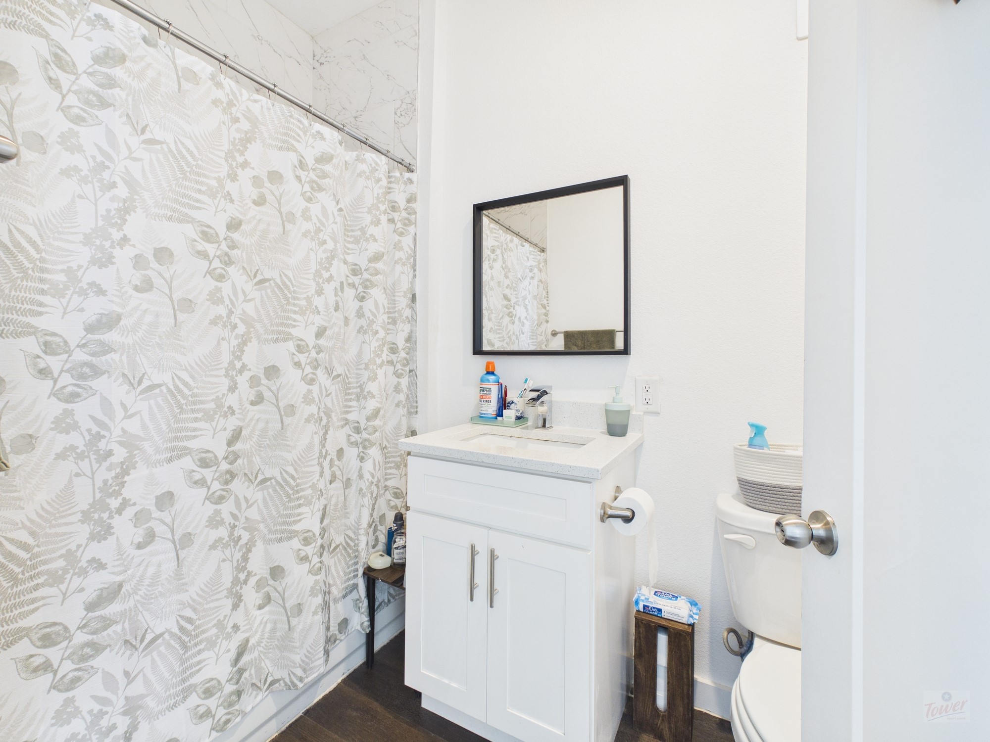 1010 West 26th Street, Unit 406 Austin, TX 78705 - Photo 5 of 6 a bathroom with a sink and a mirror