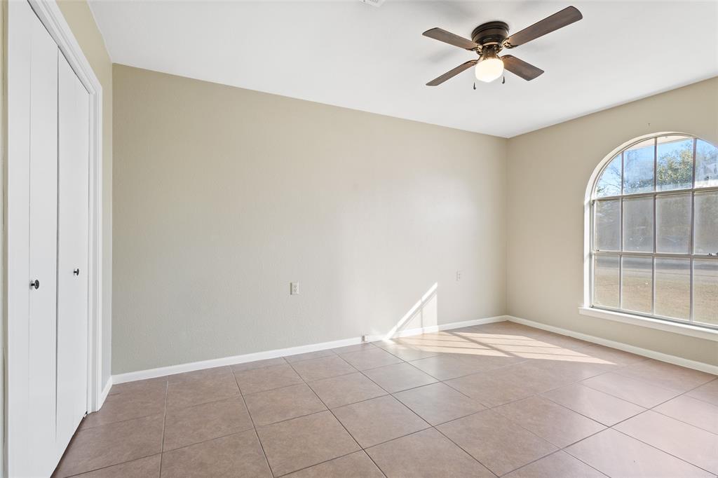 1206 Anetta Street Bowie, TX 76230 - Photo 10 of 21 a view of an empty room with a window
