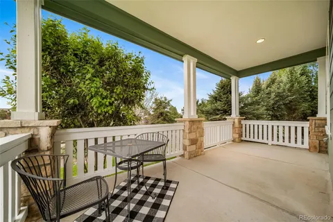 a dining room with furniture entryway and wooden floor