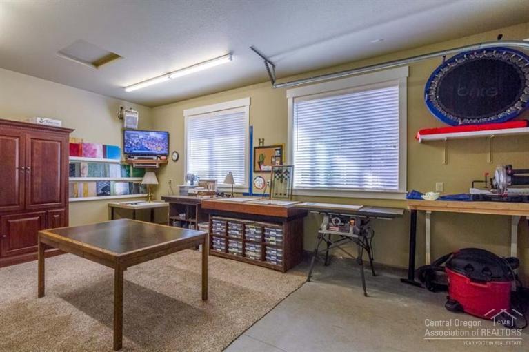 22 Oregon Loop Sunriver, OR 97707 - Photo 21 of 25 a kitchen with stainless steel appliances granite countertop a sink and cabinets
