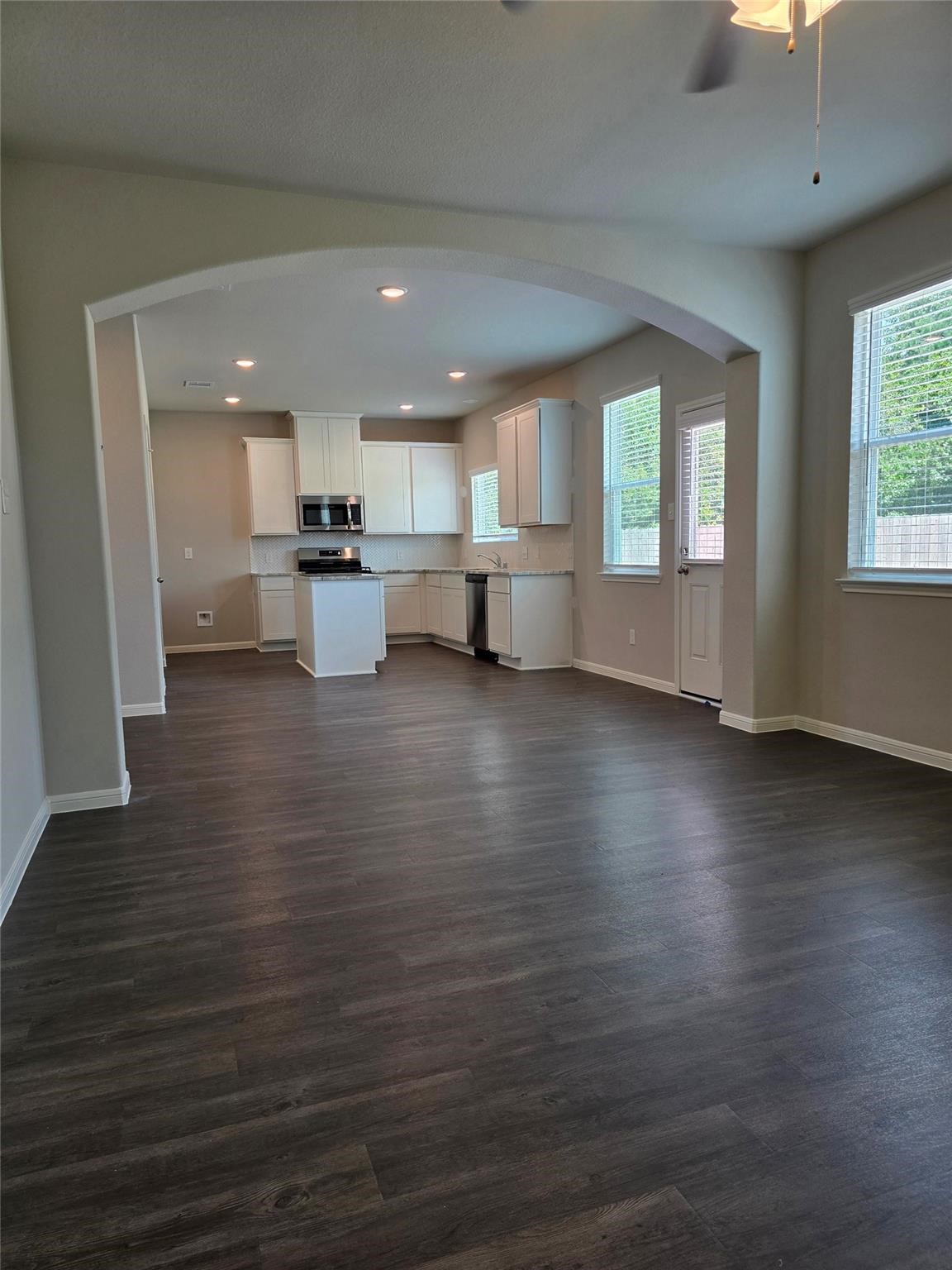 15905 Cy Young Court Splendora, TX 77372 - Photo 8 of 16 a view of a kitchen with furniture and wooden floor