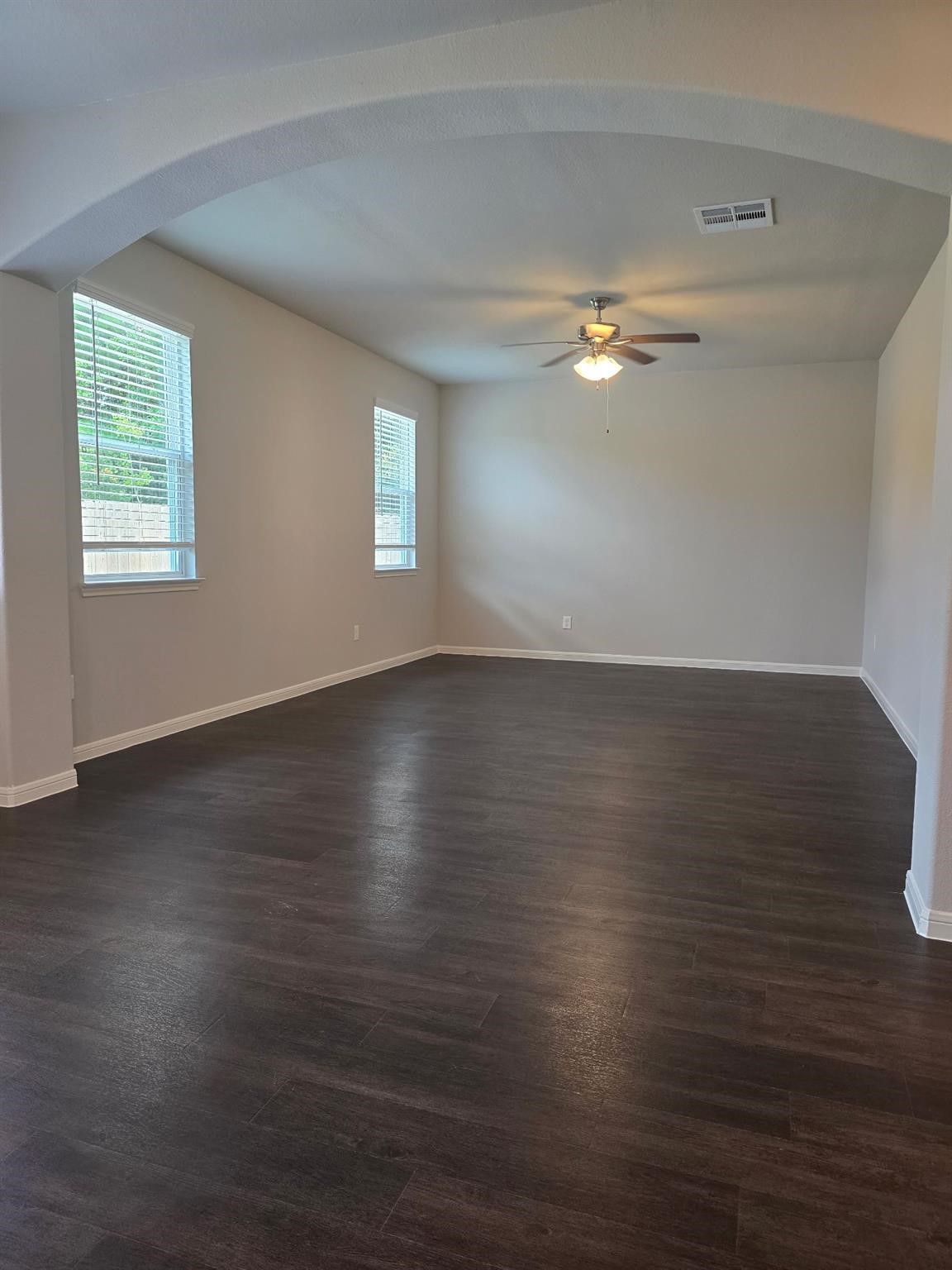 15905 Cy Young Court Splendora, TX 77372 - Photo 10 of 16 a view of empty room with wooden floor and fan