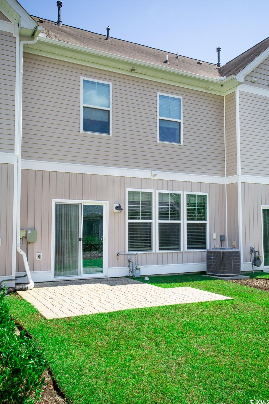 720 Pickering Drive, Unit D Murrells Inlet, SC 29576 - Photo 3 of 40 Rear view of house & patio area