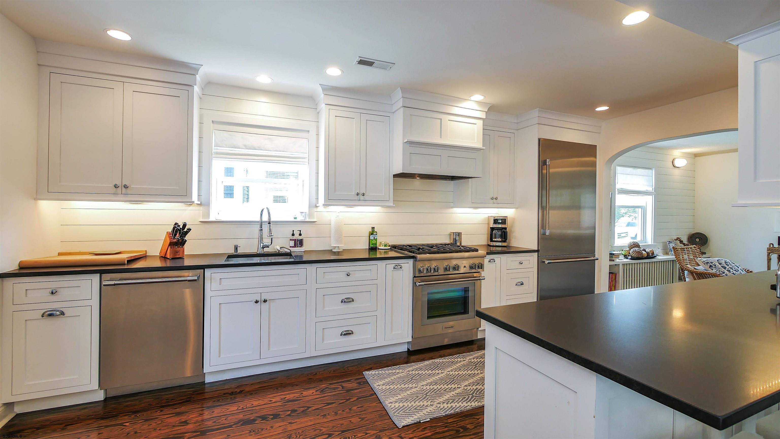 118 Pinnacle Road Ocean City, NJ 08226 - Photo 14 of 49 a kitchen with stainless steel appliances granite countertop a sink counter space and cabinets