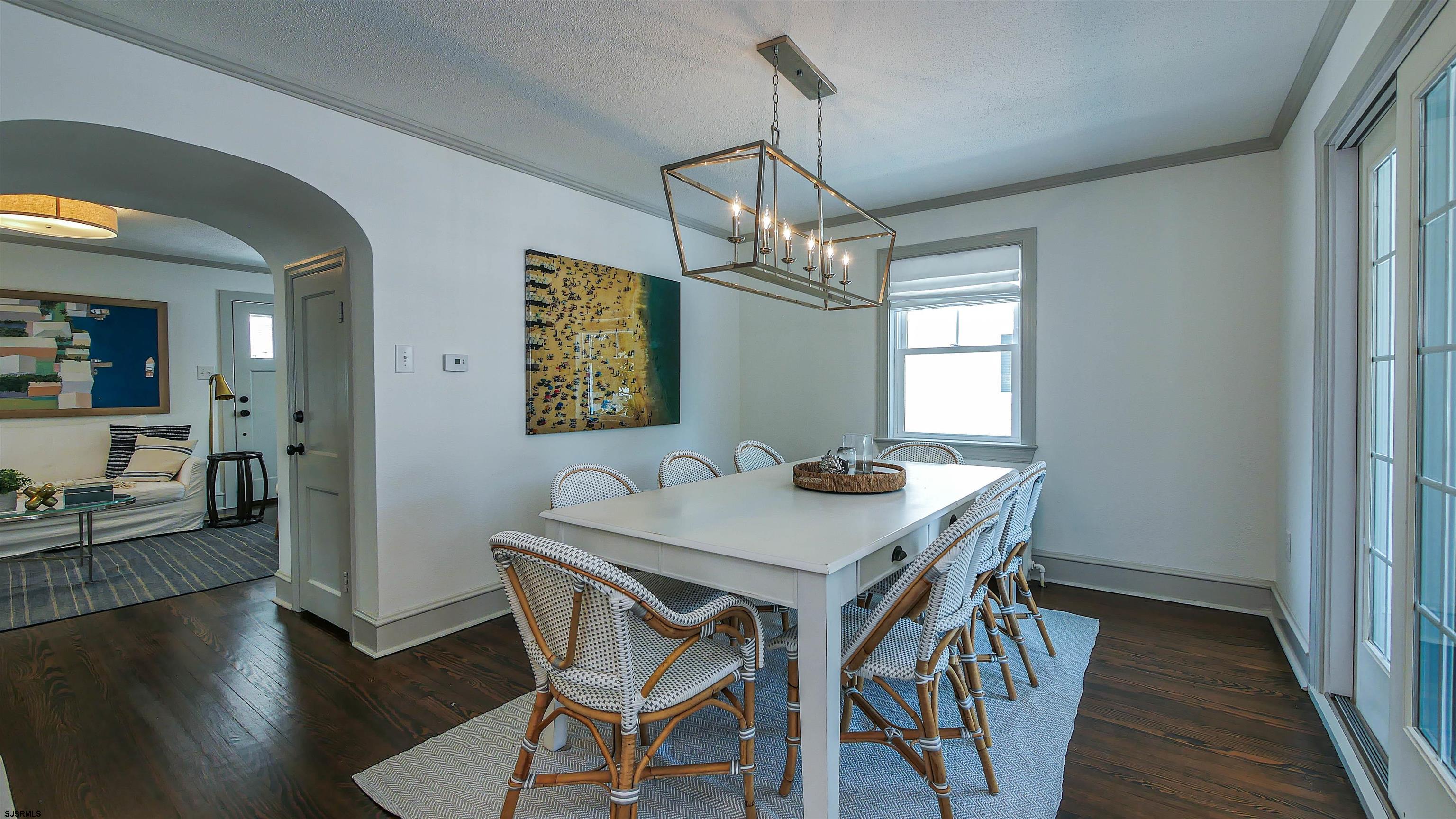 118 Pinnacle Road Ocean City, NJ 08226 - Photo 17 of 49 a view of a dining room with furniture wooden floor and a chandelier