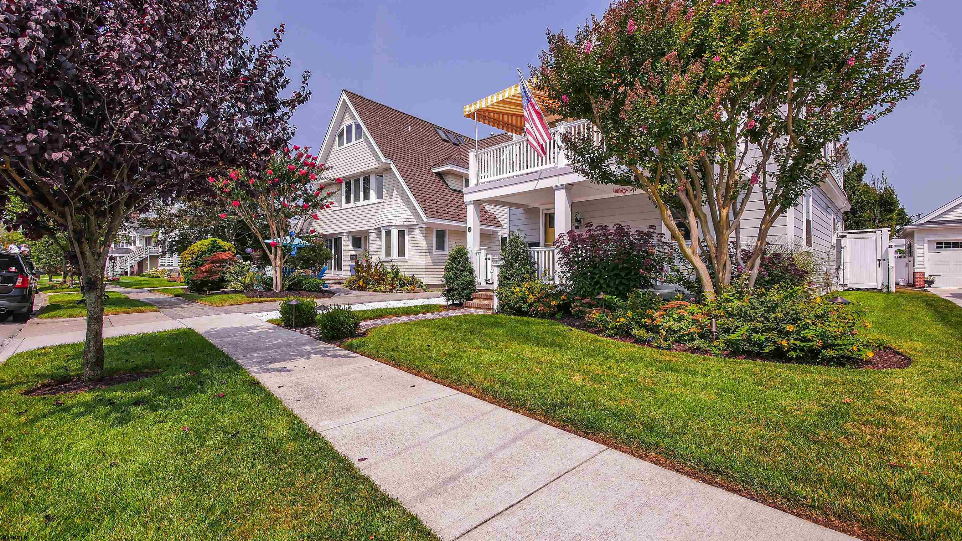 118 Pinnacle Road Ocean City, NJ 08226 - Photo 2 of 49 a front view of a house with a yard and trees
