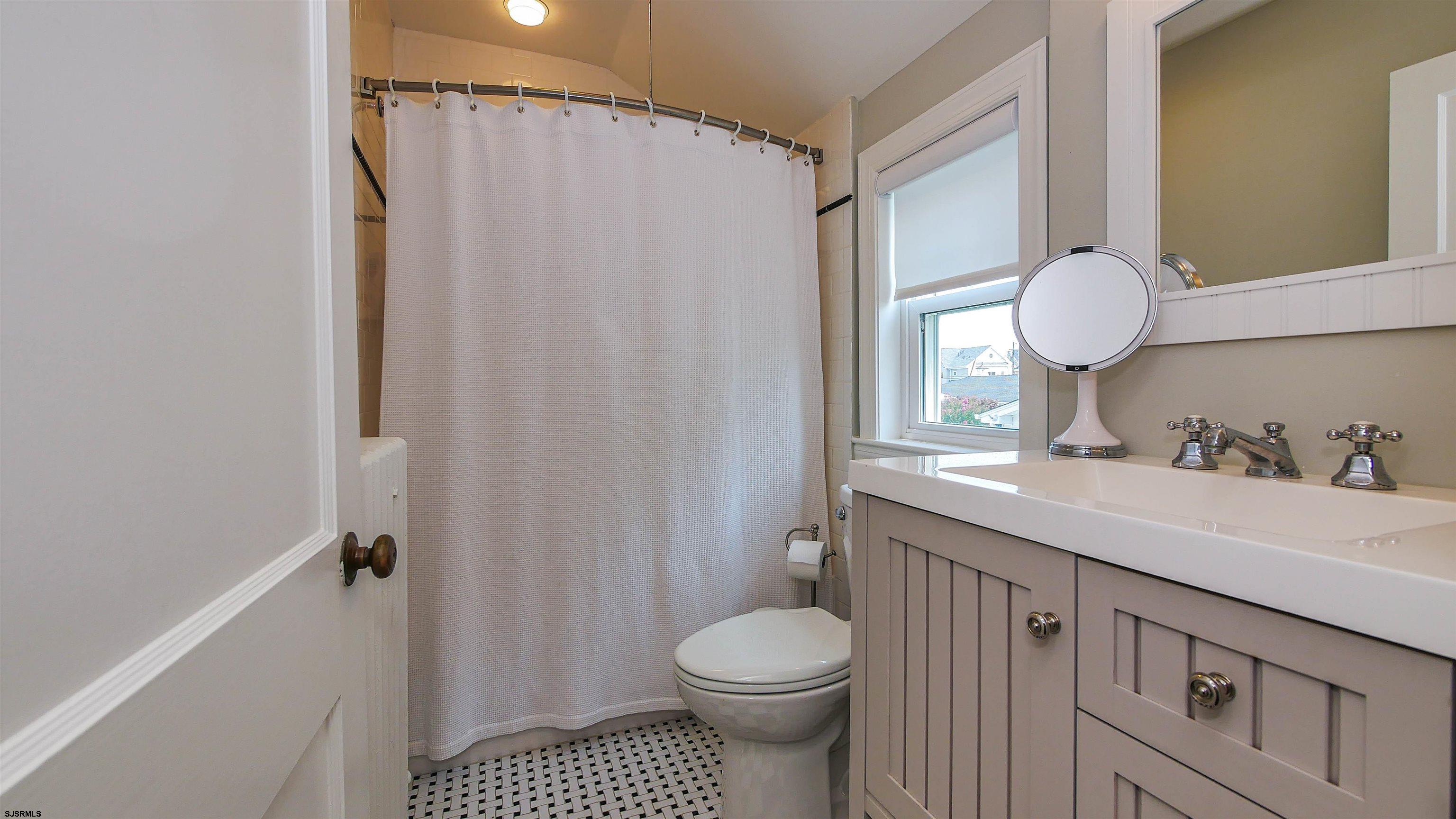 118 Pinnacle Road Ocean City, NJ 08226 - Photo 31 of 49 a bathroom with a sink a toilet and shower