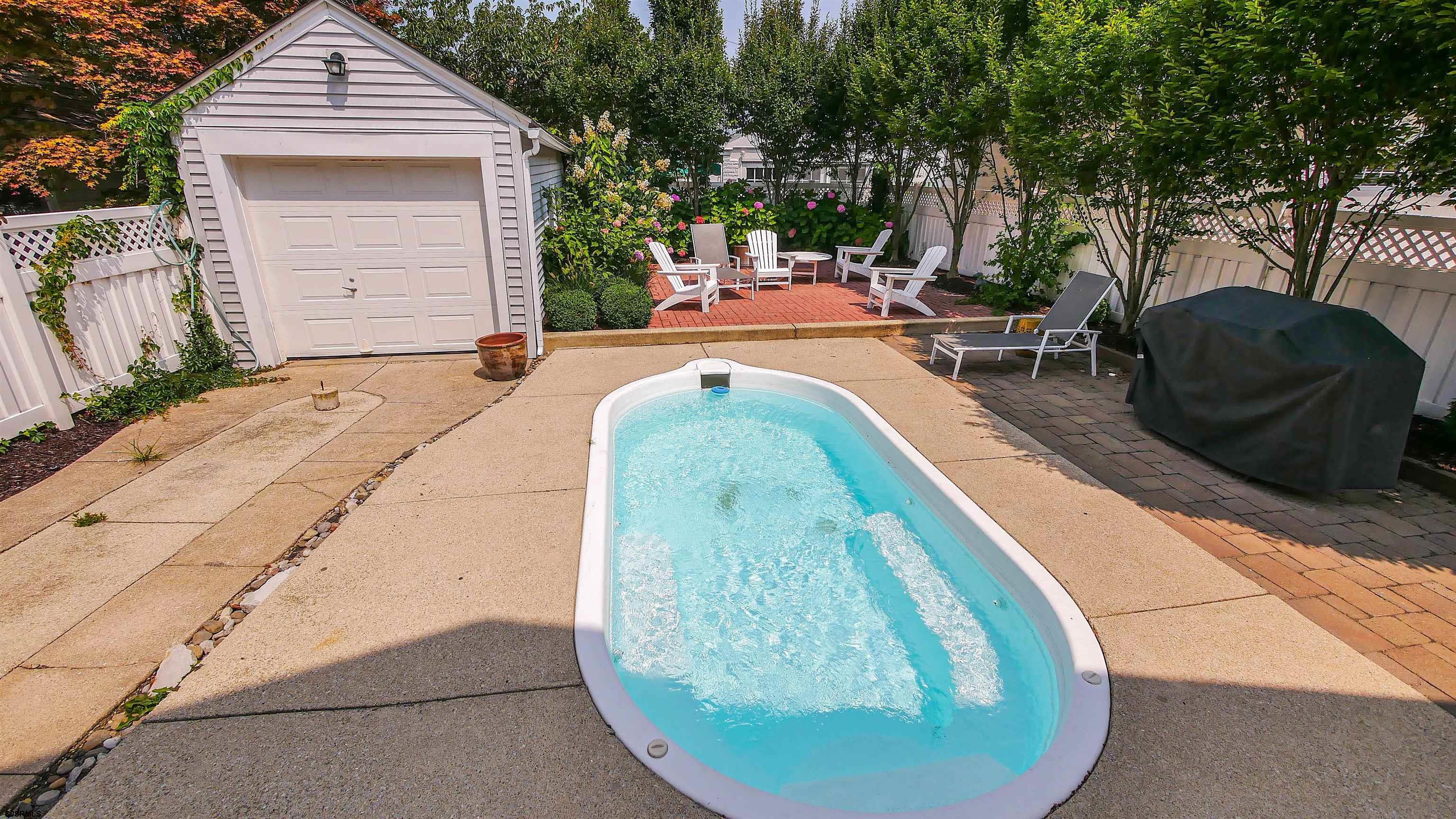 118 Pinnacle Road Ocean City, NJ 08226 - Photo 44 of 49 a view of a wooden house with a yard patio and fire pit