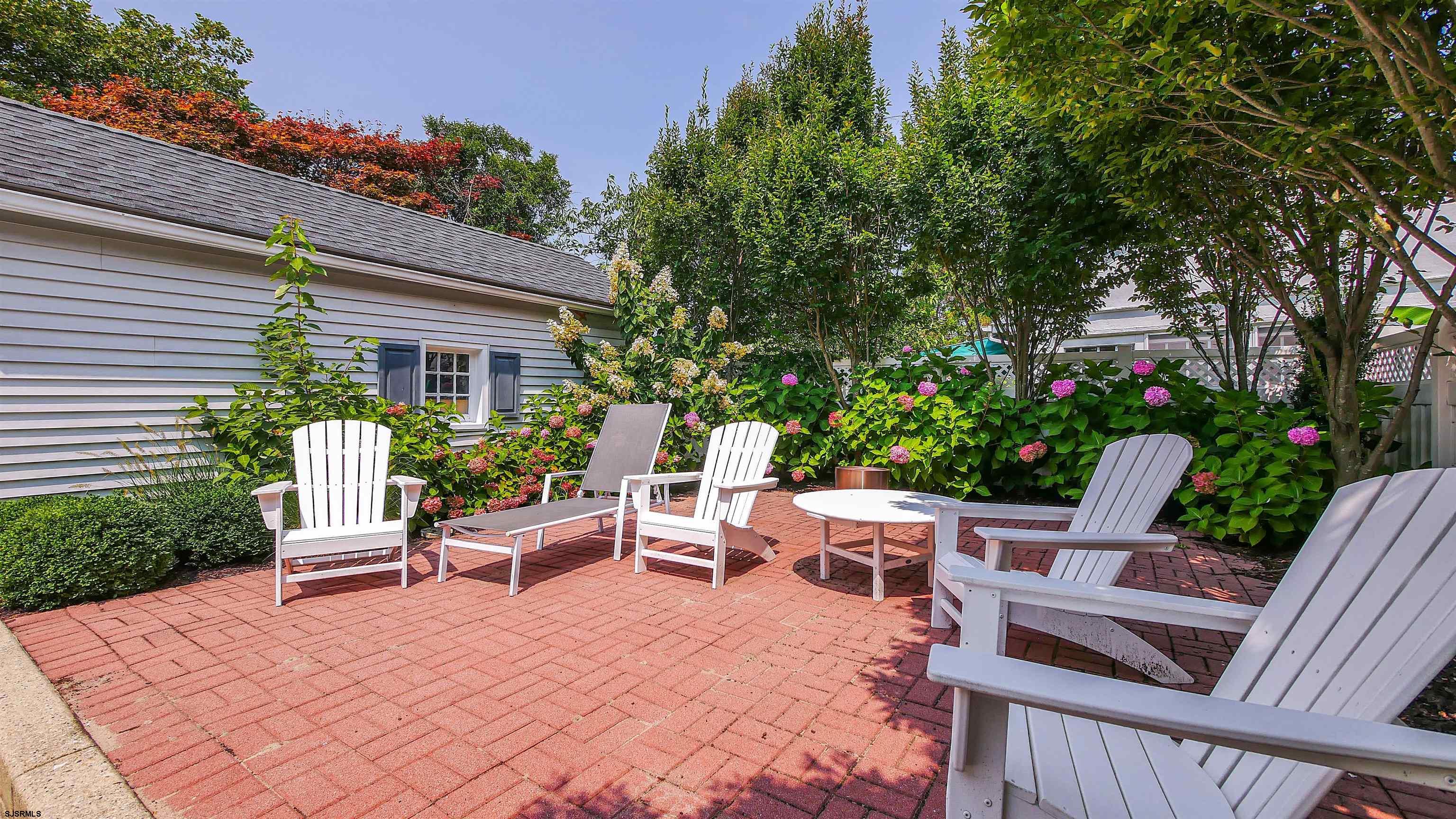 118 Pinnacle Road Ocean City, NJ 08226 - Photo 48 of 49 a view of a patio with a table and chairs and potted plants