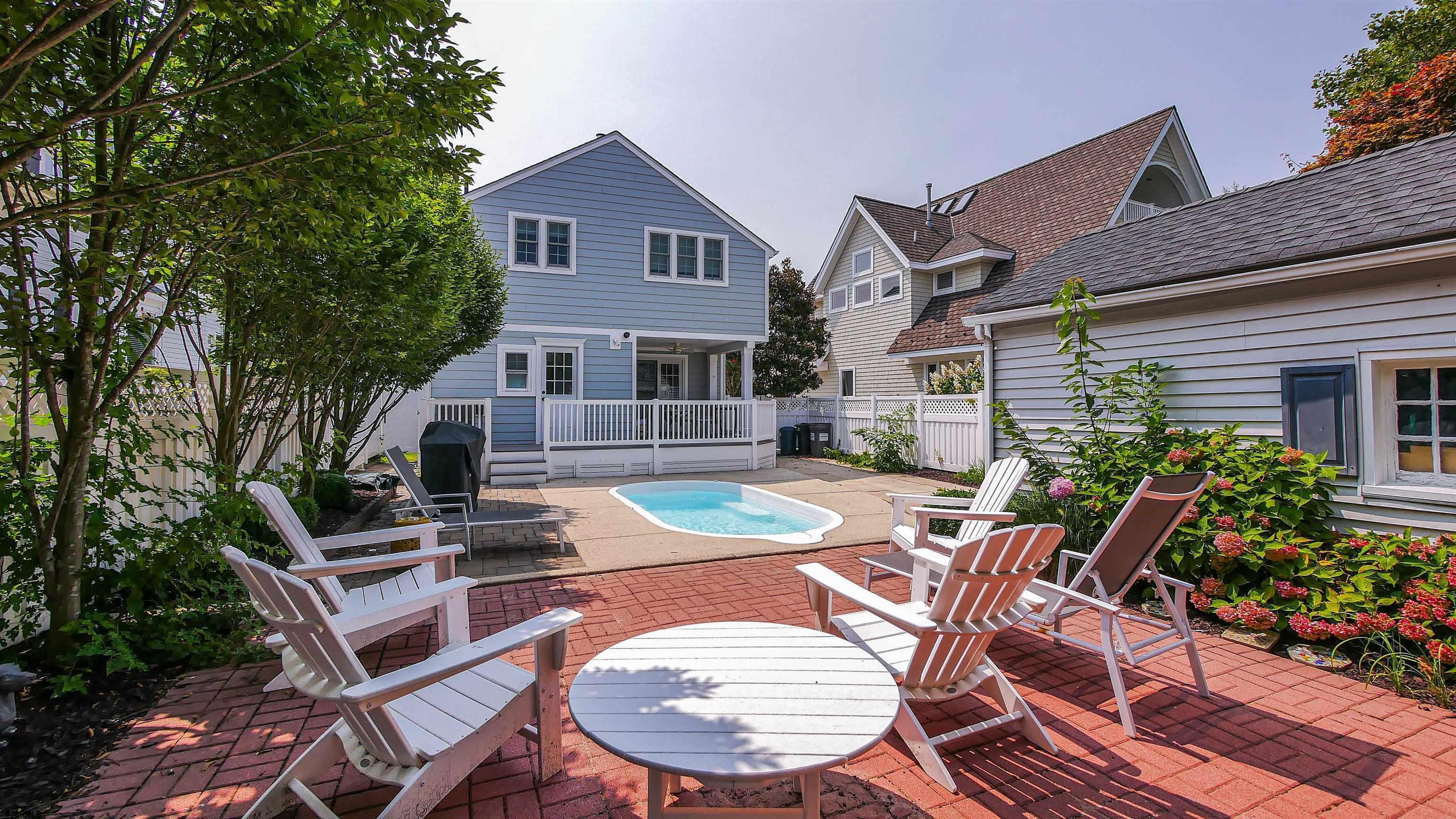 118 Pinnacle Road Ocean City, NJ 08226 - Photo 49 of 49 a view of a house with backyard sitting area and furniture